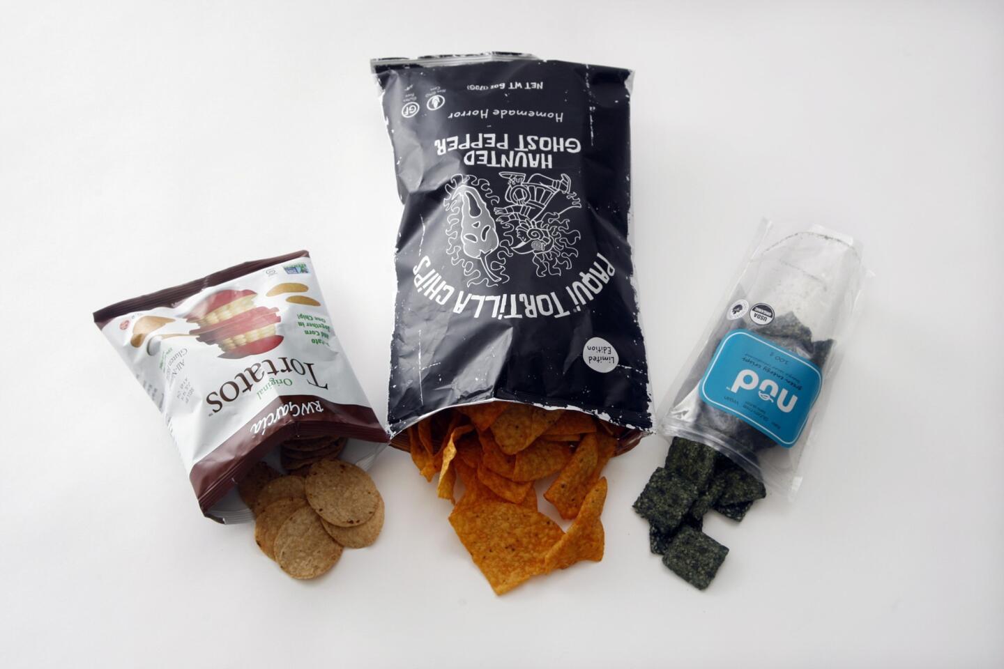 Given market research showing that more people are replacing lunch with snacks, efforts to up our nutritional snacking game are a plus, which isn't to say they're a replacement for broccoli. Look for chips with pea flour, seaweed and other vegetables, not just potatoes or corn. Supereats chips all have kale as the first ingredient. Nud Fud's green chips are made from bananas, coconut, sesame and spirulina. R.W. Garcia found a tasty combination with Tortatos, a corn and potato combination. Good Boy Organics from the Finger Lakes region of New York had Organicasaurus: baked organic corn snacks in dinosaur shapes. Beanitos brought out puffs in cheddar and hot chili to add to its line of bean chips. Popcorn appeared in many guises, including 100-calorie bags from Skinny Pop and Half Pops kernels.