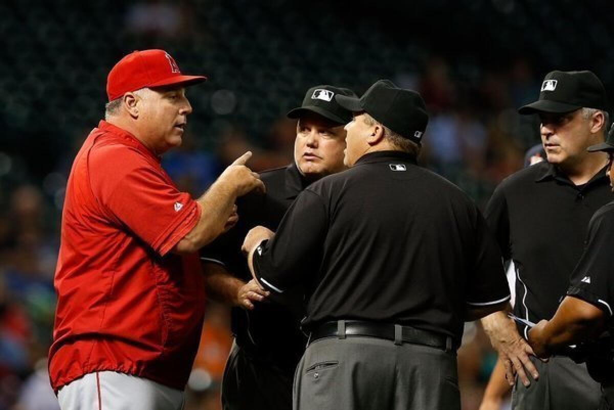 Angels Manager Mike Scioscia argues a call with the umpire in the seventh inning of a game against the Houston Astros on May 9.