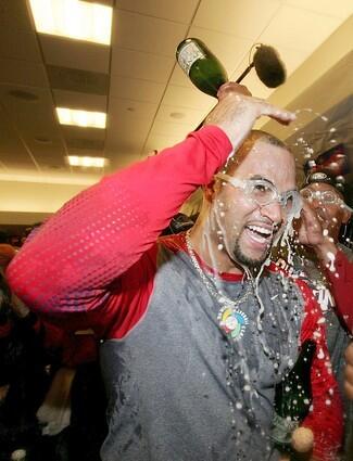 Albert Pujols, of the St. Louis Cardinals in the locker room celebrates after defeating the Detroit Tigers.