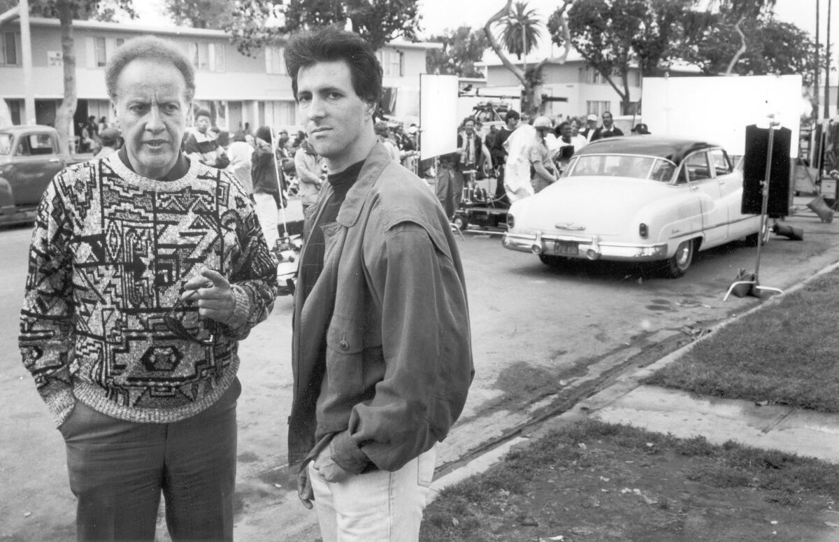 Bob Richardson, left, and Michael Lazarou in 1990 on the set of "Heat Wave," a movie about the Watts riots.