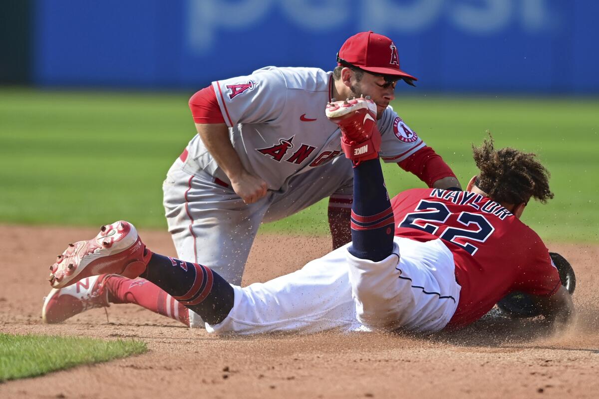 Angels second baseman David Fletcher tags out Cleveland Guardians' Josh Naylor attempting to steal second base.