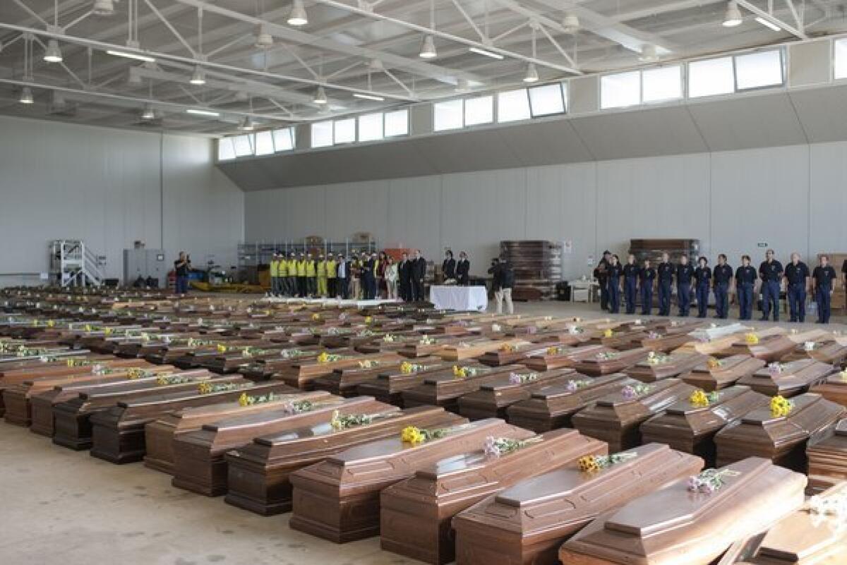 A hangar on the Italian island of Lampedusa has become a makeshift morgue for victims of the Oct. 3 sinking of a boat carrying some 500 migrants from Africa. European Union officials toured the disaster recovery operations on Wednesday, drawing taunts and protests from survivors of the tragedy and local residents of the island that has become the main illegal entry point for boat people.