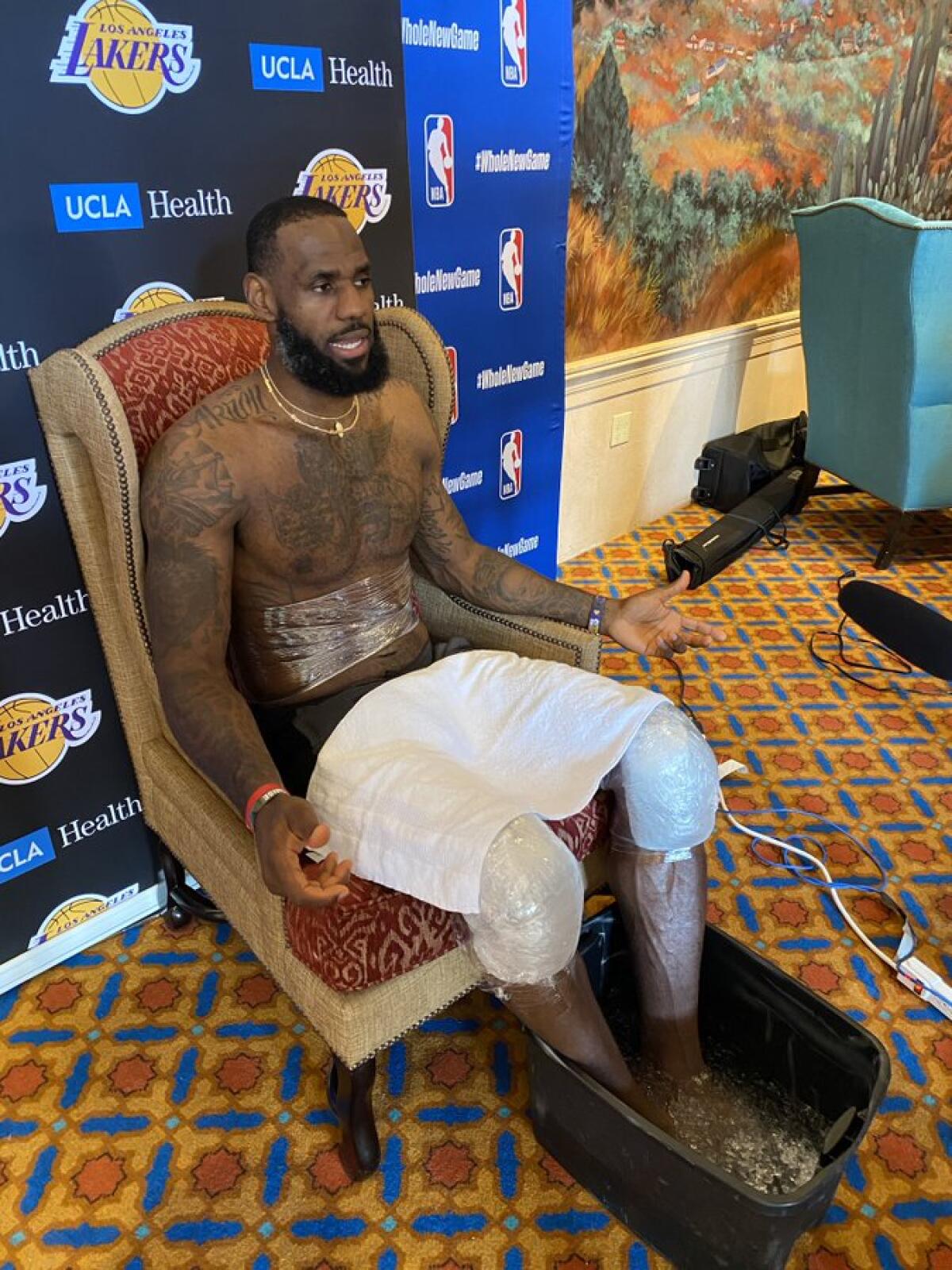 Lakers star LeBron James sits in an unusually ornate chair for his media session Tuesday.