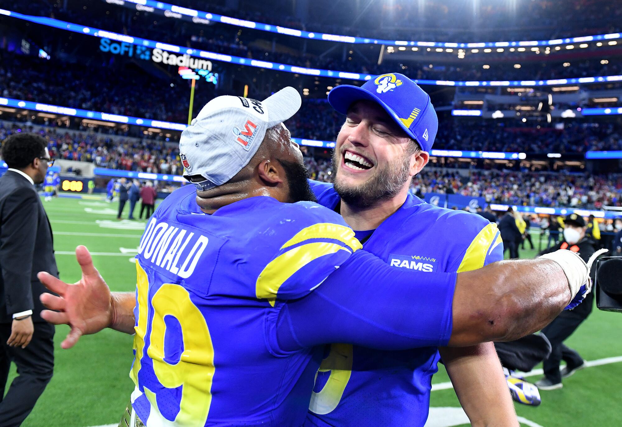 Rams defensive lineman Aaron Donald celebrates with quarterback Matthew Stafford after winning the NFC championship.