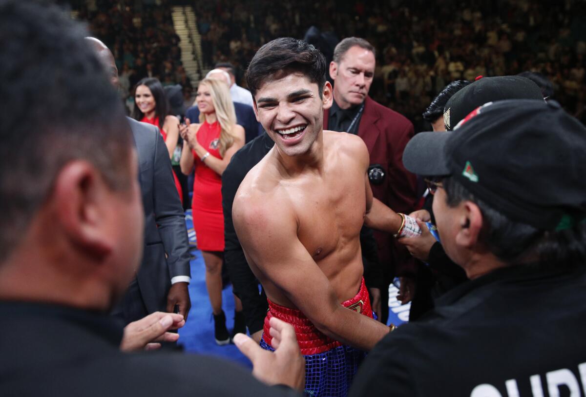 Ryan Garcia celebrates after defeating Romero Duno. 