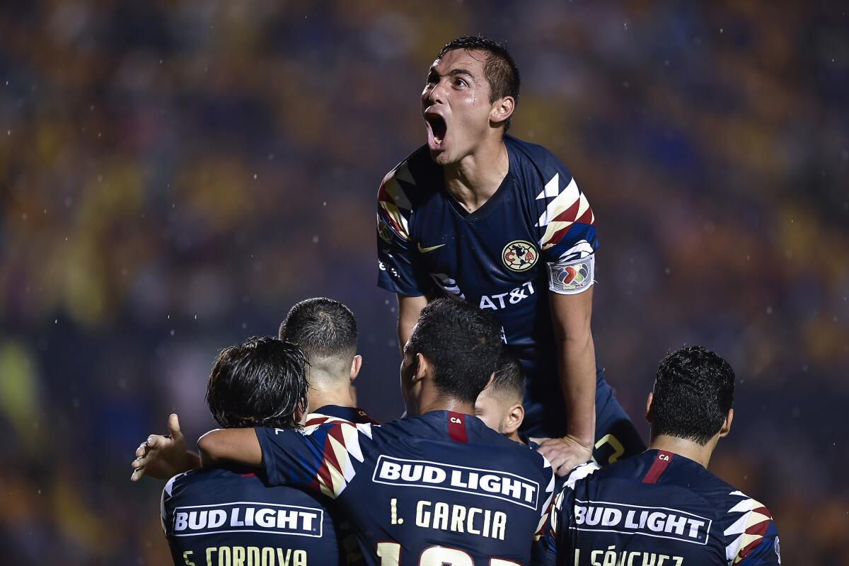 MONTERREY, MEXICO - AUGUST 24: Francisco Córdova, #17 of América, celebrates with teammates after scoring his team's first goal during the 6th round match between Tigres UANL and America as part of the Torneo Apertura 2019 Liga MX at Universitario Stadium on August 24, 2019 in Monterrey, Mexico. (Photo by Azael Rodriguez/Getty Images) ** OUTS - ELSENT, FPG, CM - OUTS * NM, PH, VA if sourced by CT, LA or MoD **