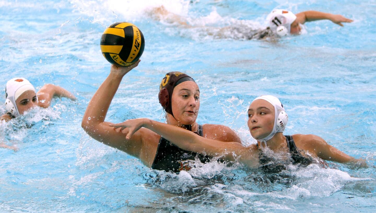 La Ca–ada High School girls water polo player #10 Mimi Zwaneveld scores a goal under pressure from #17 Jael Osborne during home game vs. South Pasadena High School, at the Spartans pool in La Ca–ada Flintridge on Thursday, Jan. 19, 2017. LCHS throttled SPHS 15-4.