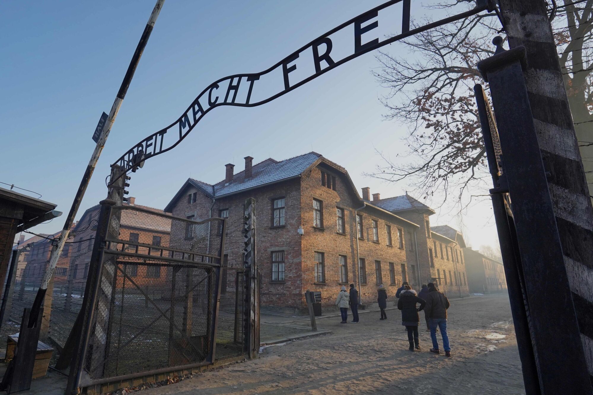 The main gate with the inscription of "Arbeit macht frei" ("Work sets you free") at the entrance to Auschwitz.