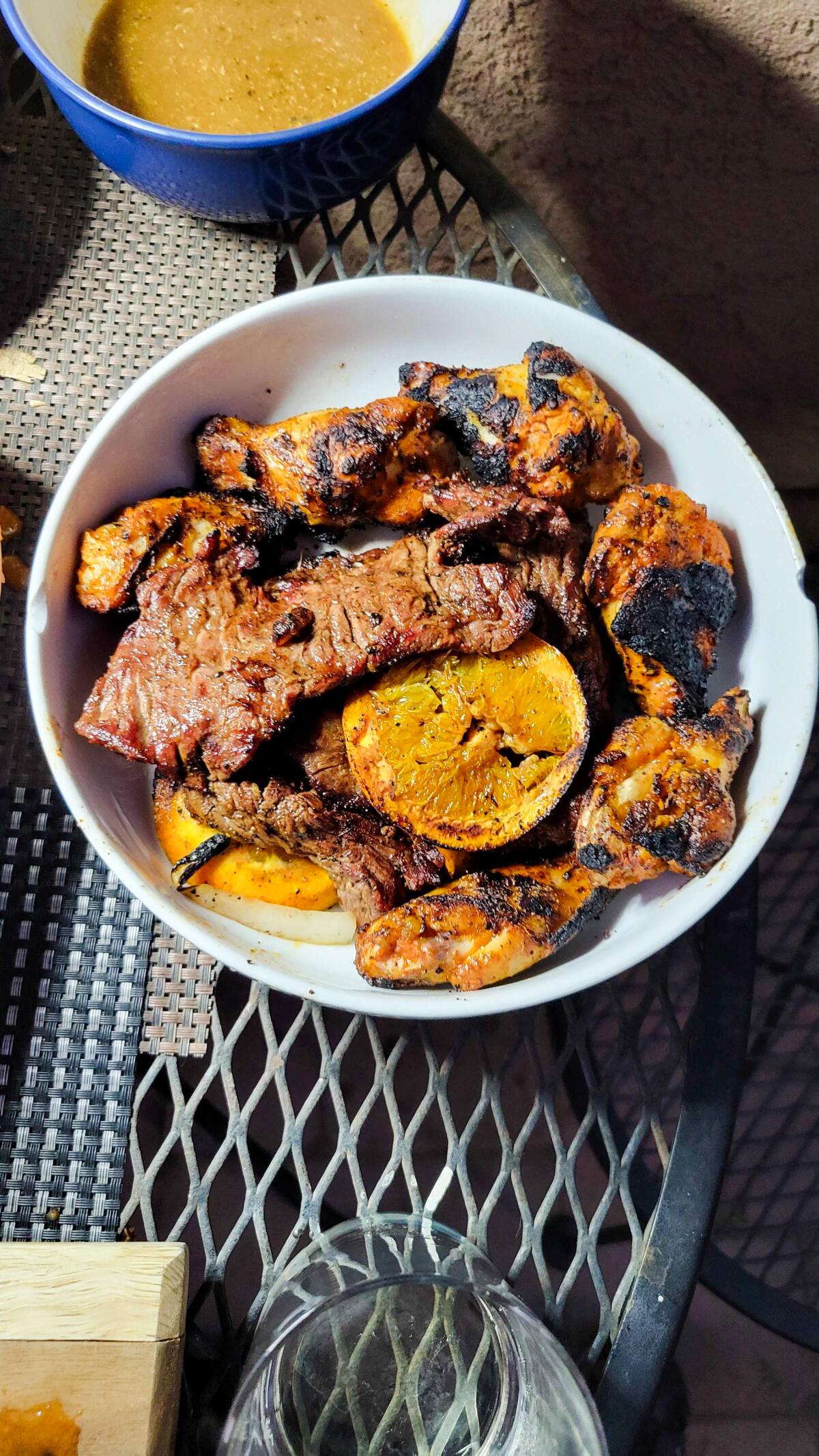 Carne asada and prepared chicken wings marinated with Famosa lager, orange and L.A. Asada seasoning.