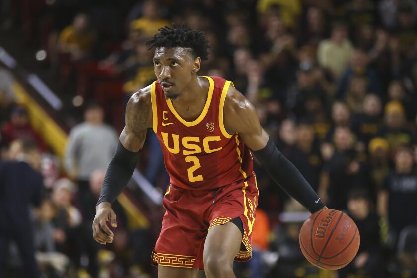 Southern California guard Jonah Mathews dribbles the ball against Arizona State during the first half of an NCAA college basketball game Saturday, Feb. 8, 2020, in Tempe, Ariz. Arizona State defeated Southern California 66-64. (AP Photo/Ross D. Franklin)
