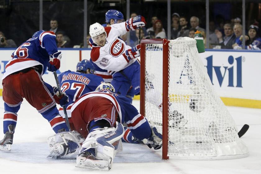 Montreal's Daniel Briere (48) scores in the third period of the Canadiens' 3-2 overtime win Thursday over the New York Rangers. New York leads the series 2-1.