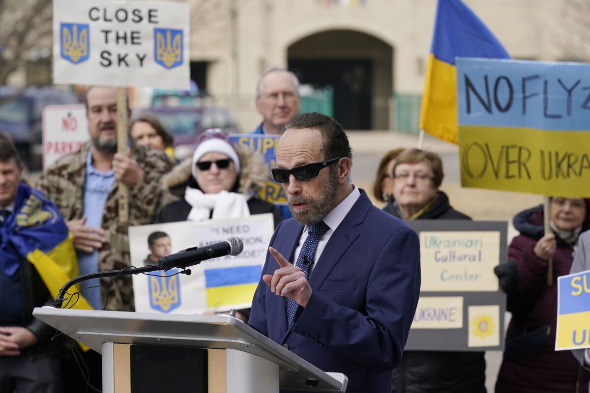 Jim Fouts, the mayor of Warren, Mich., addresses dozens of Ukrainian Americans at City Hall Wednesday, March 16, 2022, in Warren, Mich. Fouts said "we can never overlook the dangers posed by ignoring what is going on in Ukraine." (AP Photo/Carlos Osorio)