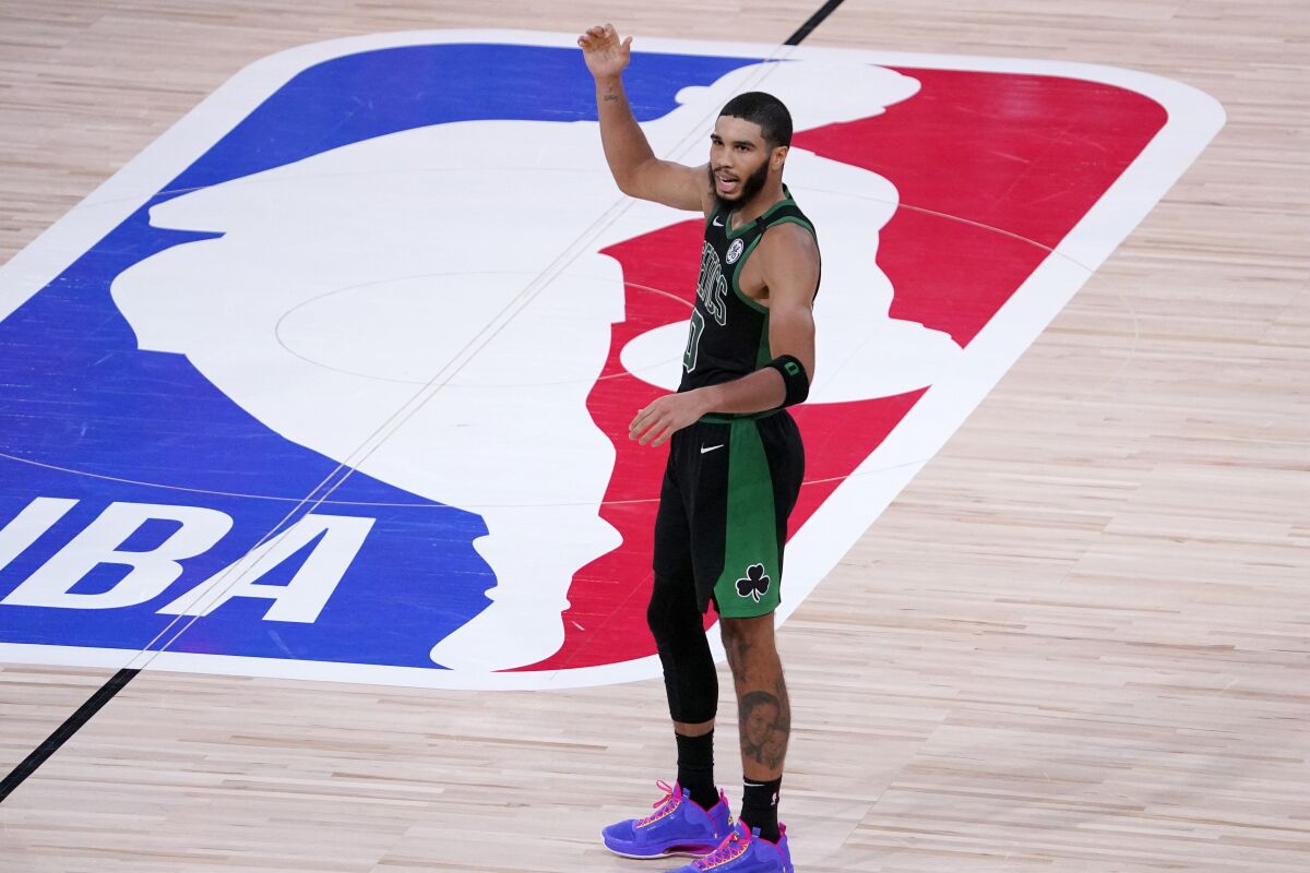 Boston Celtics' Jayson Tatum reacts during the second half of an NBA conference semifinal playoff basketball game against the Toronto Raptors Friday, Sept. 11, 2020, in Lake Buena Vista, Fla. The Celtics won 92-87. (AP Photo/Mark J. Terrill)