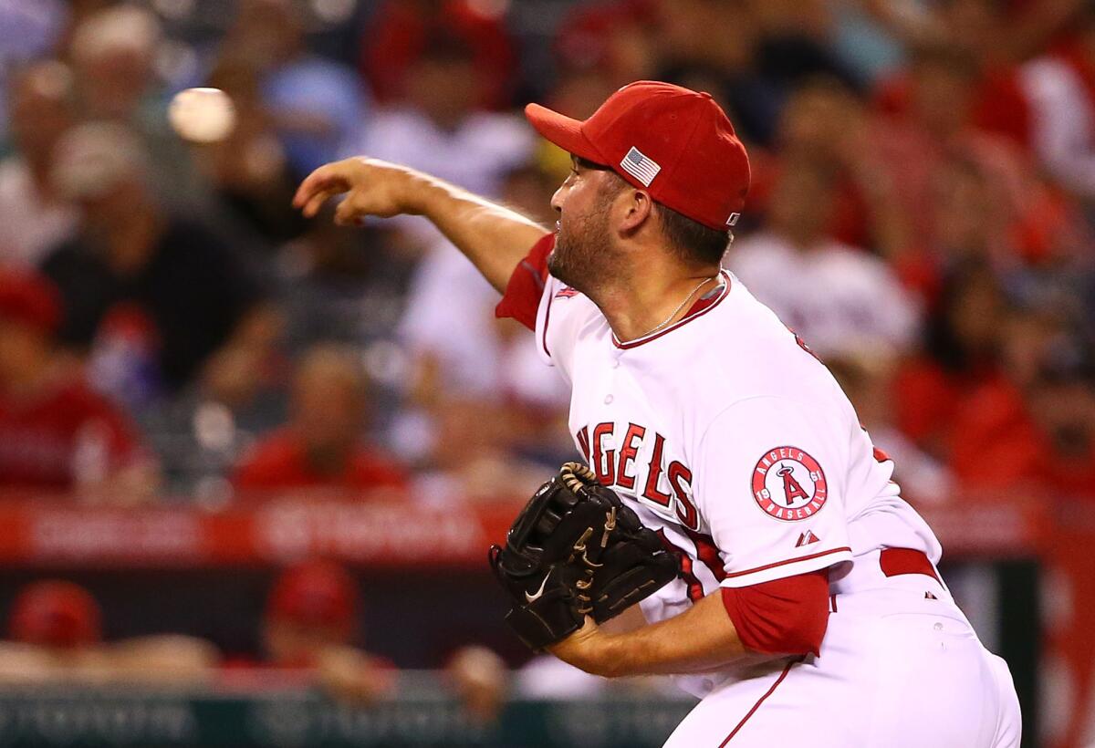 Closer Huston Street pitches during the ninth inning of a game against the Houston Astros in Anaheim on Sept. 11.