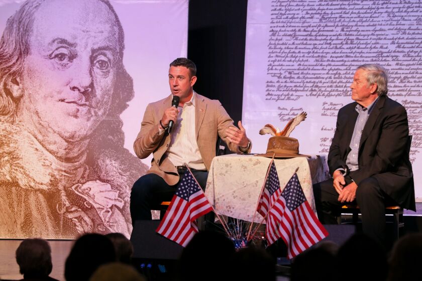 May 25, 2019_Ramona, California, USA_| Congressman Duncan Hunter, left, and his father, retired Congressman Duncan Hunter speak about border issues at their town hall meeting at the Ramona Mainstage theater. |_Photo Credit: Photo by Charlie Neuman