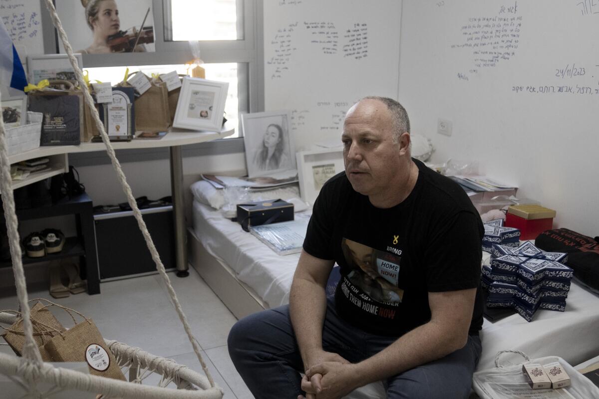 Shlomi Berger sitting in his 19-year-old daughter's bedroom in Holon, Israel
