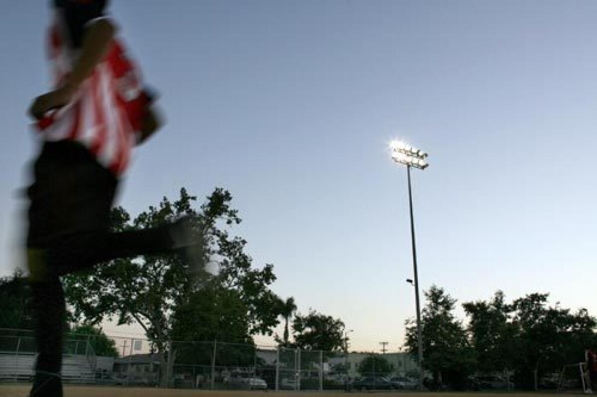 There are precious few public green spaces in South Los Angeles; Ross Snyder Recreation Center is one of them. The Summer Night Lights program will keep the lights on there until midnight. >>more photos >>