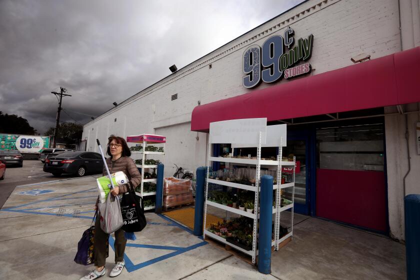 SANTA MONICA, CA - APRIL 5, 2024 - - Nancy D. leaves the 99 Cent Only store with her purchases in Santa Monica on April 5, 2024. The stores will be closing soon. "It's an enormous loss for people of limited income," said Nancy D. who has been shopping at the store for over 20 years. (Genaro Molina/Los Angeles Times)