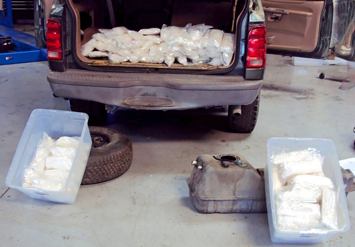 This Friday, Jan. 10, 2020 photo released by U.S. Customs and Border Protection shows some of more than $190,000 worth of methamphetamine concealed in a vehicle along a Southern California highway, the agency said in a statement Monday, Jan. 13, 2020. An agent patrolling Interstate 15 followed a suspicious vehicle Friday as it exited onto U.S. 395 and parked at a gas station in the unincorporated Rainbow area of San Diego County south of Temecula, the agency said. A search dog alerted to the vehicle as the agent spoke to the driver and a detailed inspection found more than 100 pounds (45.3 kilograms) of meth in 96 packages inside the gas tank, spare tire and quarter panels of the Ford Explorer, the Border Patrol said. The driver, only identified as a 34-year-old U.S. citizen, was arrested. (U.S. Customs and Border Protection via AP)
