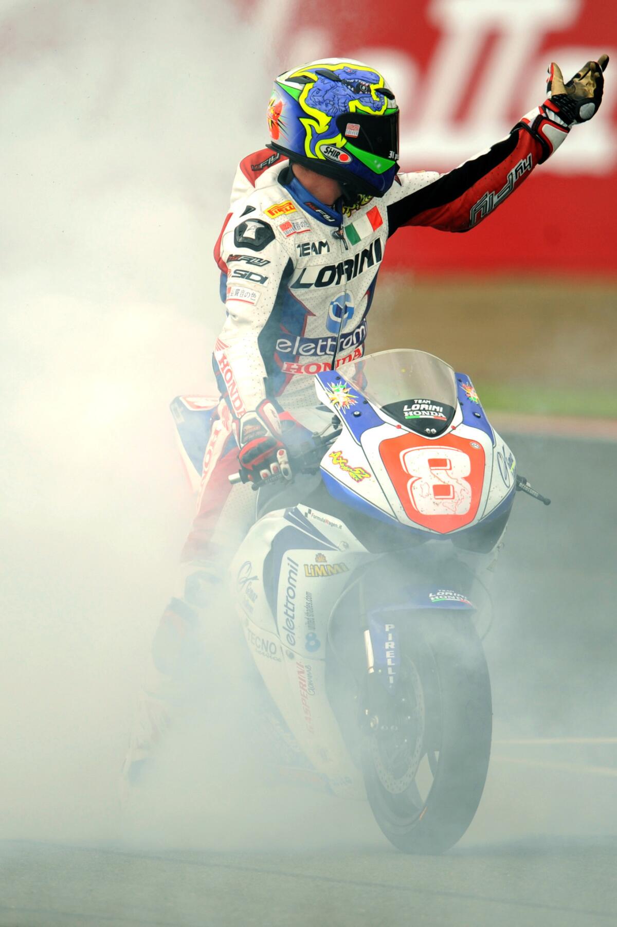 Andrea Antonelli of Italy gestures to the crowd after finishing in third position in the Superstock 1000 FIM Cup race at the Silverstone circuit on August 1, 2010.