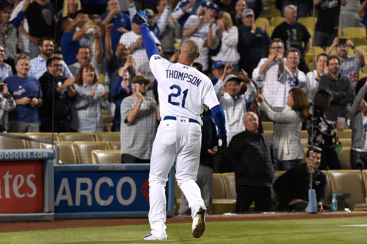 Dodgers outfielder Trayce Thompson (21) acknowledges the crowd after hitting a walk-off home run to defeat the Rockies, 4-3.