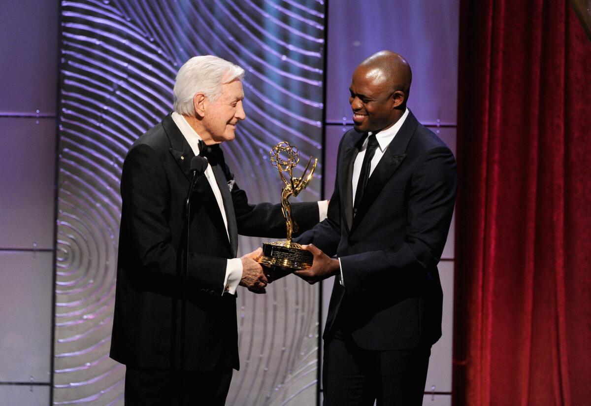 TV personality Wayne Brady presents Monty Hall with the Lifetime Achievement Award during the Daytime Emmy Awards at the Beverly Hilton Hotel in Beverly Hills.