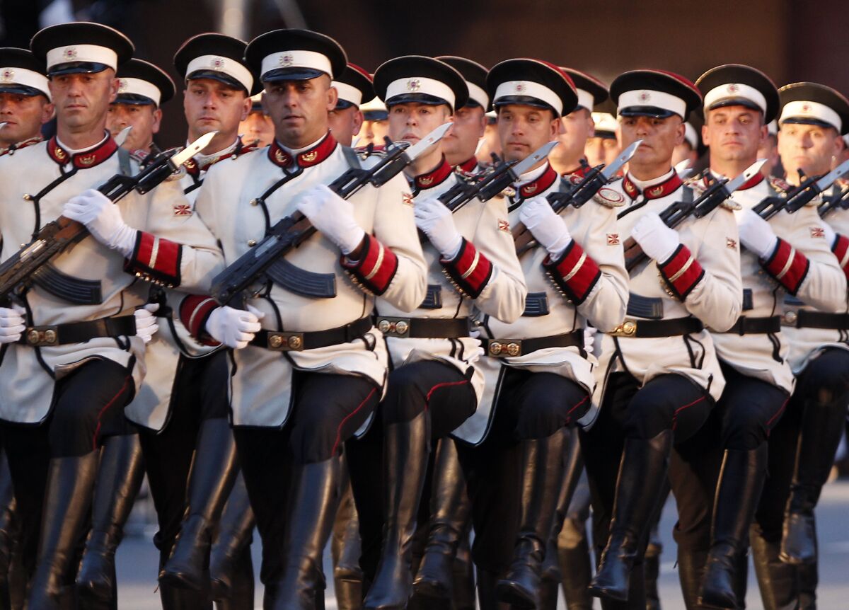 Army honor guard soldiers march during a parade to mark the Independence Day in downtown Skopje, North Macedonia, Wednesday, Sept. 8, 2021. North Macedonia is celebrating Wednesday the 30th anniversary since its independence from former Yugoslavia. (AP Photo/Boris Grdanoski)