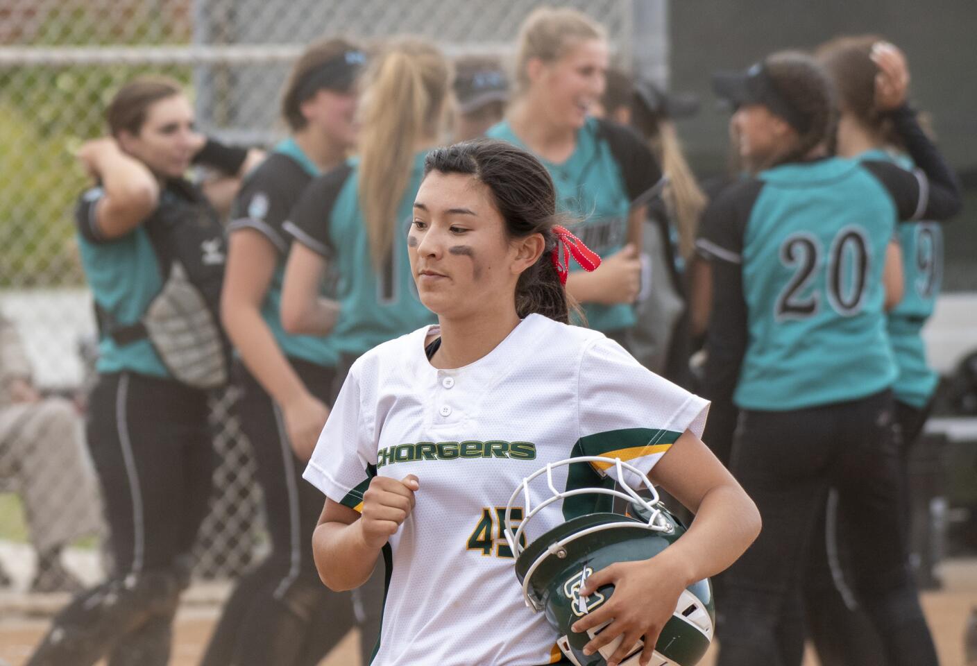 Edison's Serena Starks walks back to dugout following a 1-2 loss to Aliso Niguel in a CIF Southern Section Division 2 playoff game on Tuesday, May 22.