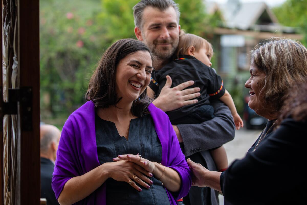 LOS ANGELES, CA - MAY 27: Daughter Valentina Martinez, left, greets guests at the funeral of her mother and former member of the Los Angeles County Board of Supervisors Gloria Molina takes place at Resurrection Catholic Church, Los Angeles, CA. (Irfan Khan / Los Angeles Times)