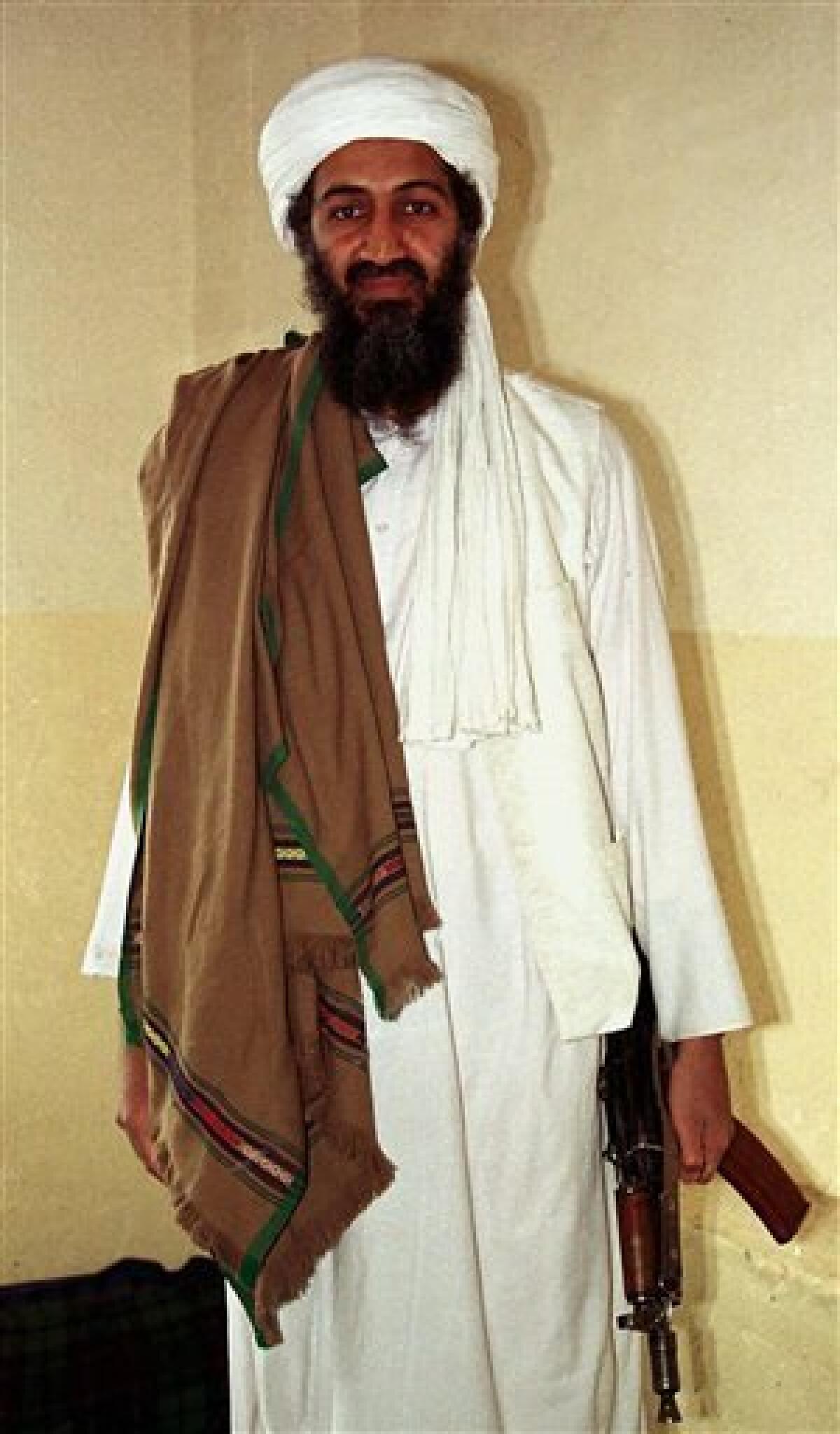 FILE- This April 1998 file photo shows Osama bin Laden in Afghanistan. Osama bin Laden threatened Americans in a new audio tape broadcast Wednesday, June 3, 2009, saying President Barack Obama inflamed hatred toward the U.S. by ordering Pakistan to crack down on militants in Swat Valley and block Islamic law in the area. (AP Photo)