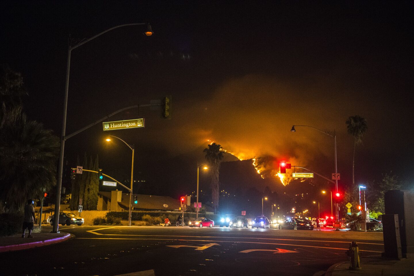 The Fish fire as seen from Huntington Drive near the site of evacuations in Bradbury on Monday night.
