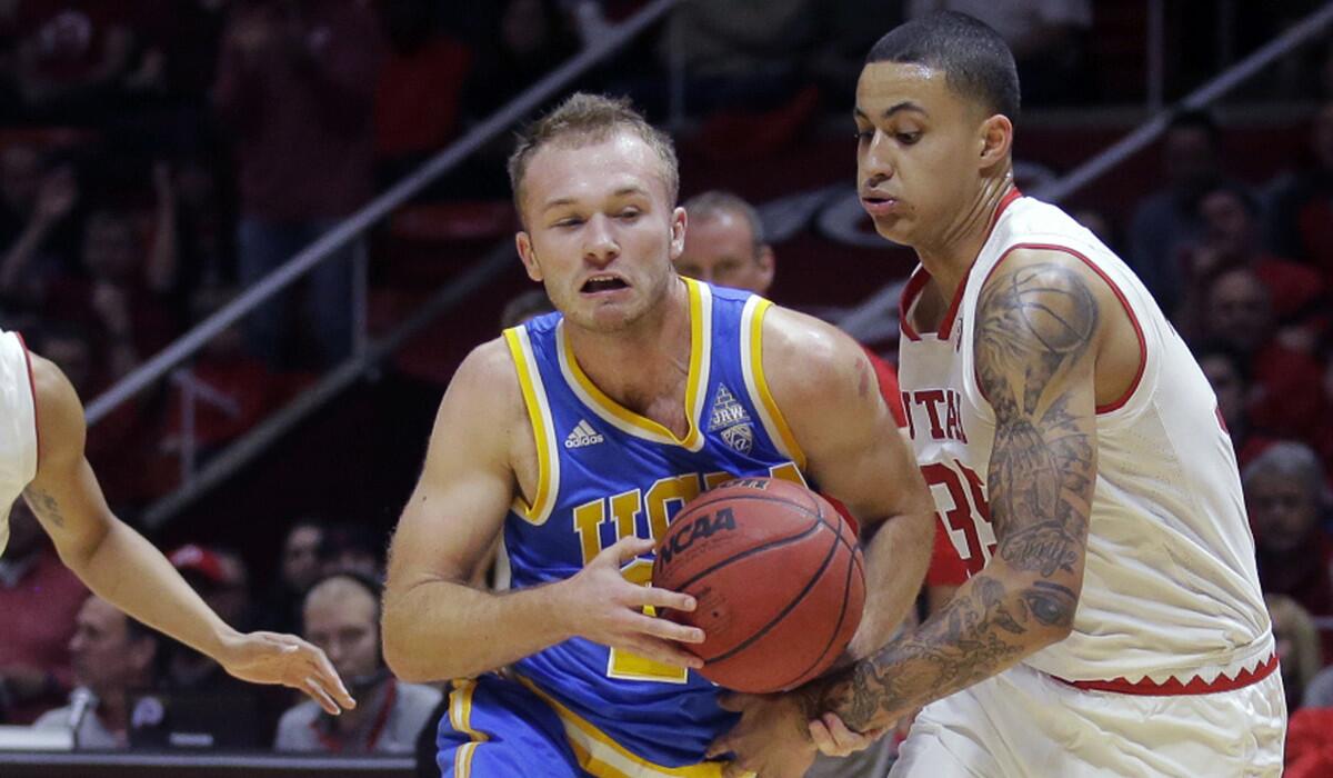 UCLA guard Bryce Alford, left, drives as Utah forward Kyle Kuzma, right, defends during the first half on Saturday.