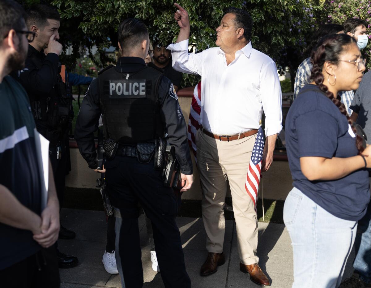 Pasadena mayor Victor Gordo speaks with police at Villa Parke.