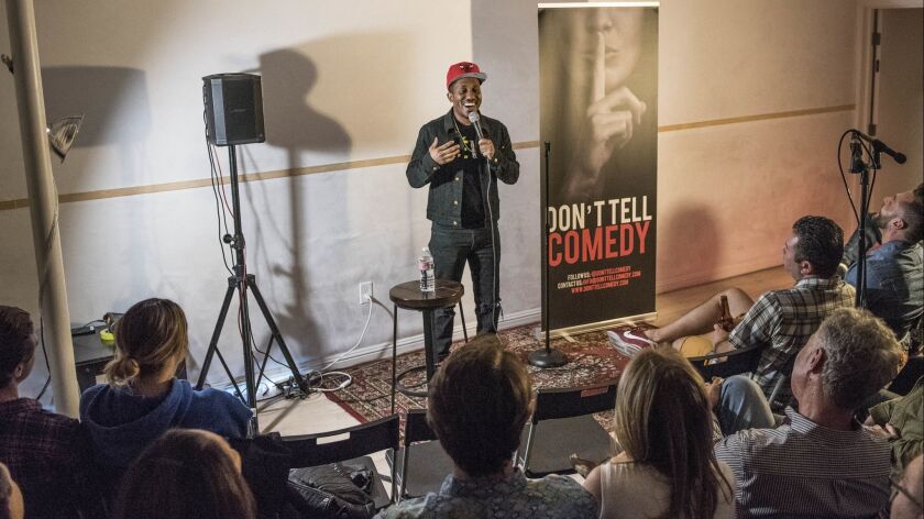 Chris Redd, a cast member on "Saturday Night Live," does a set during Don't Tell Comedy, a secret comedy show at Tree4ort recording studio in Hollywood. The comedy series hosts shows without disclosing the location until customers buy their tickets.