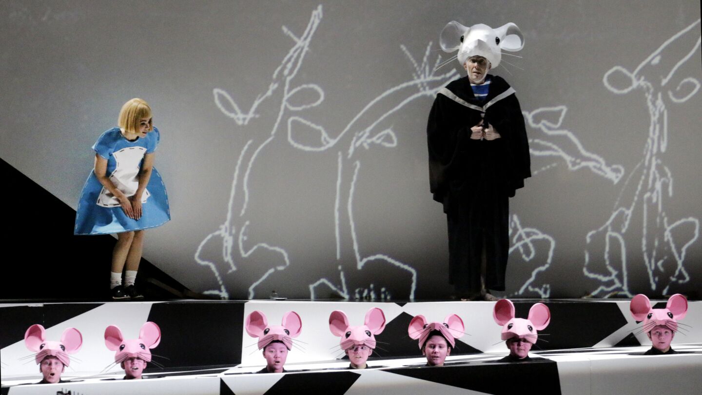 Rachele Gilmore as Alice and Christopher Lemmings as Mouse with supernumeraries in "Alice in Wonderland." Susanna Malkki conducted the Los Angeles Philharmonic in this collaboration with the L.A. Opera at Walt Disney Concert Hall.