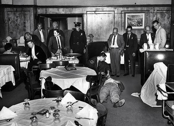 December 1959: The body of Jack "the Enforcer" Whalen lies on the floor of Rondelli's Restaurant on Ventura Boulevard. At left, officers question a witness.