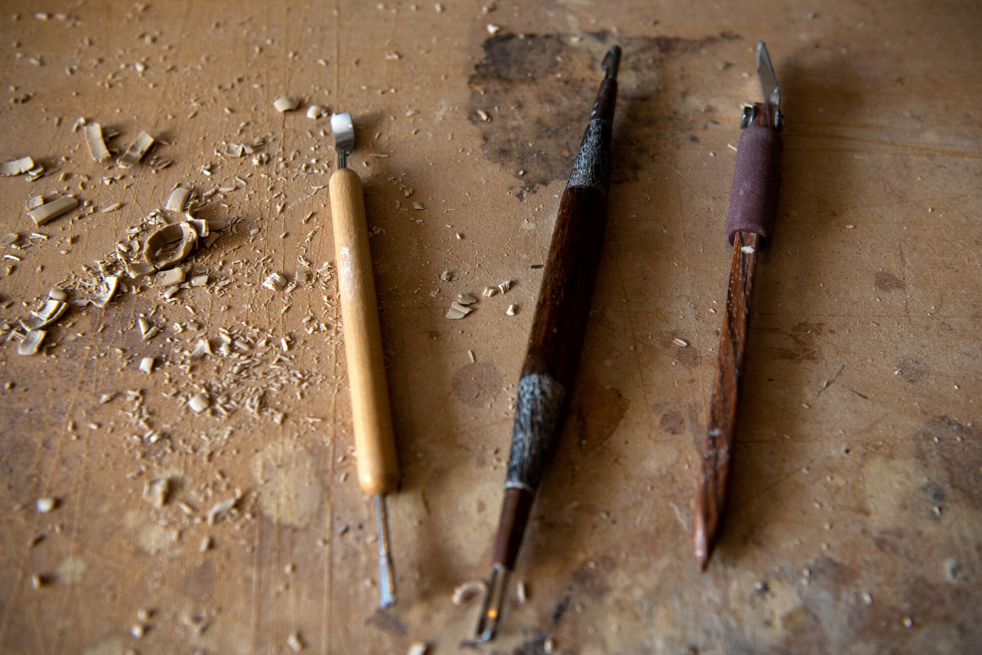 Details of clay shavings and pottery tools inside Daniel Dooreck's ceramics studio.