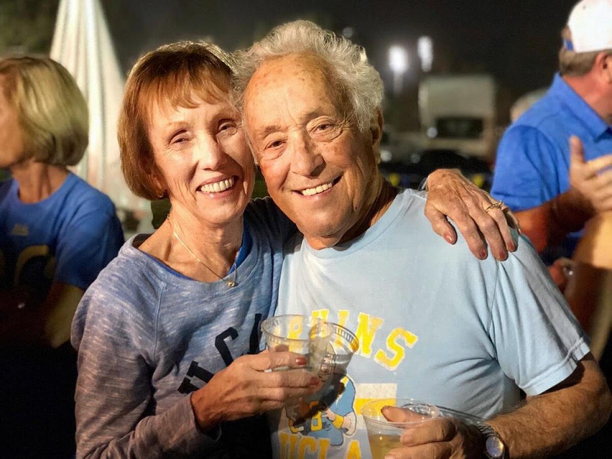 Karen and Fran Ursini, who met in junior high and married in 1962, attend a UCLA tailgating party.