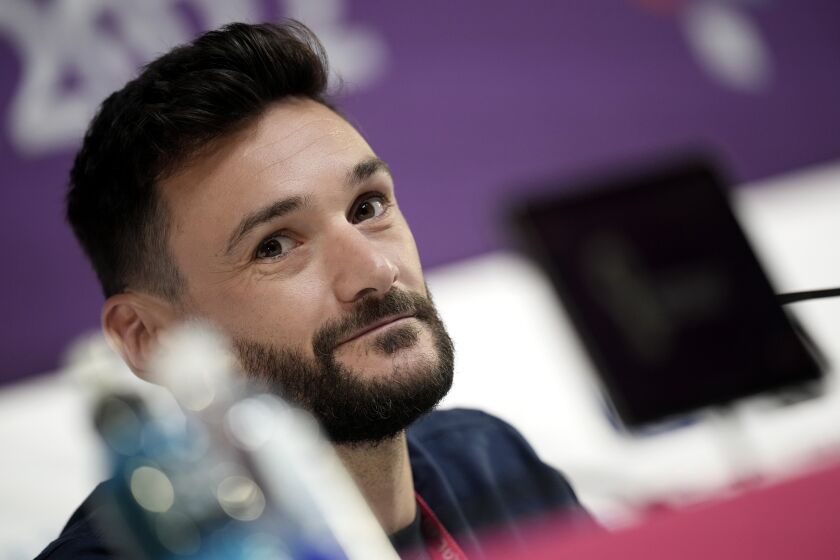 France's goalkeeper Hugo Lloris answers a reporter during a press conference in Doha, Qatar, Saturday, Dec. 3, 2022, on the eve of the World Cup soccer match between France and Poland. (AP Photo/Christophe Ena)