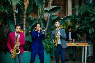 Tim McKay, Gabe Martin, Alekos Syropoulos and Kyle Woods - musicians who perform with Dart Collective - perform at a recent wedding reception.
