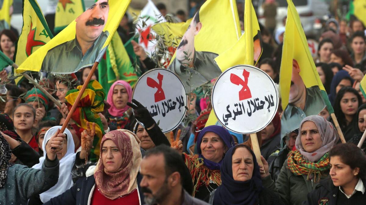 Syrian Kurds march during a demonstration in the northeastern Syrian city of Qamishli on Jan. 24, 2018, against the Turkish assault on the border enclave of Afrin.