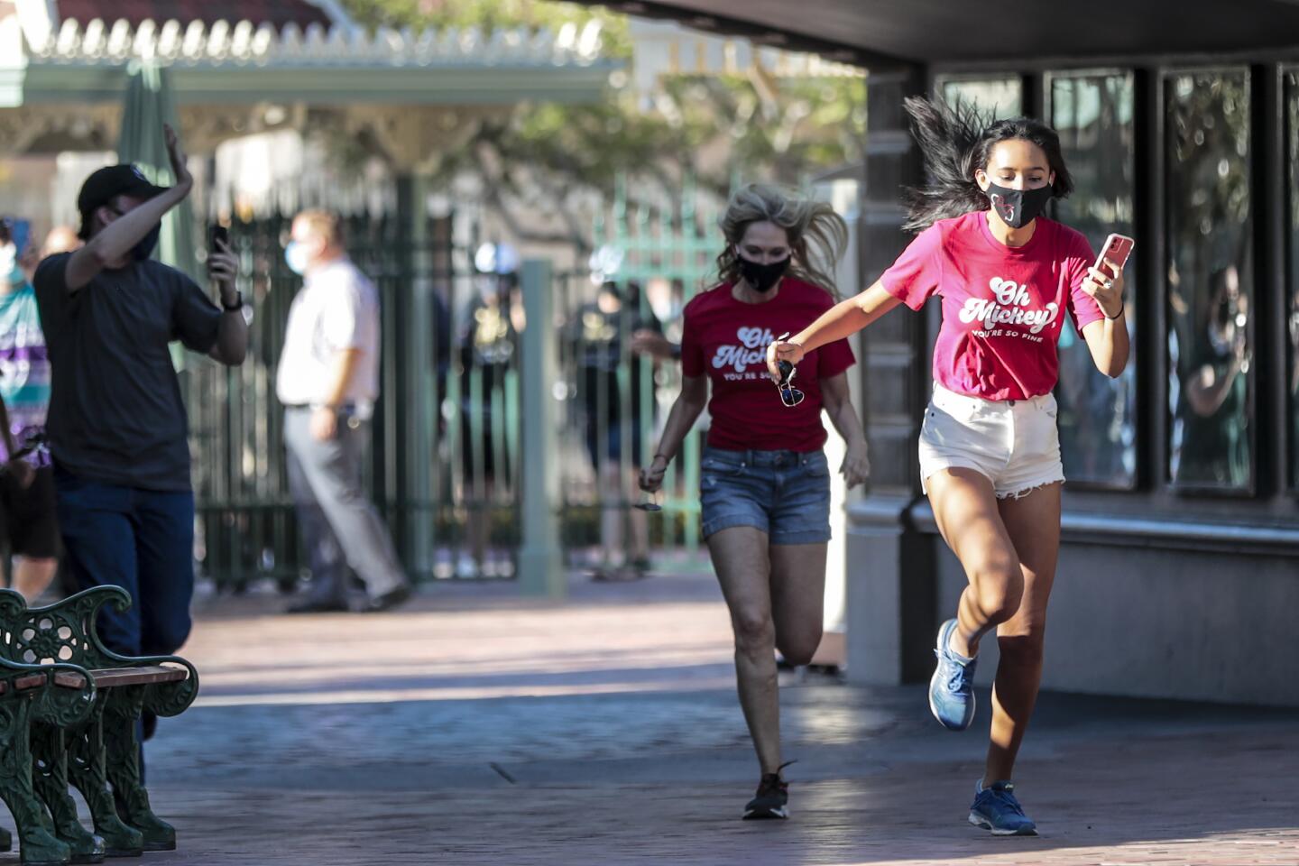 Two masked girls break into a run