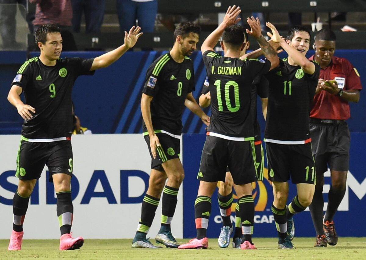 Mexico's Marco Bueno (R) celebrates with teammates after scoring his second goal against Costa Rica during their CONCACAF Mens Olympic Qualifying Group B Match on October 2, 2015, at the Stub Hub Center in Carson, California. AFP PHOTO/ ROBYN BECKROBYN BECK/AFP/Getty Images ** OUTS - ELSENT, FPG, CM - OUTS * NM, PH, VA if sourced by CT, LA or MoD **