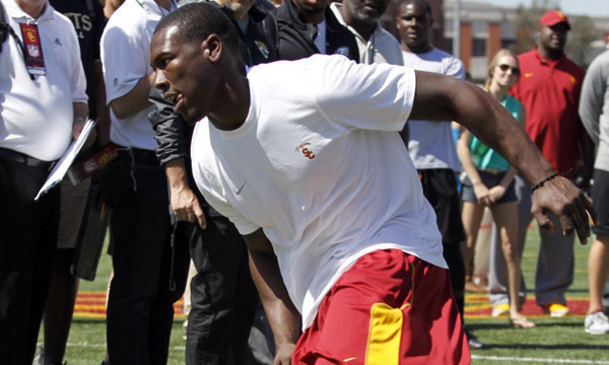 Wide receiver Marqise Lee works out in front of NFL scouts during USC's pro day at Loker Stadium on Wednesday.