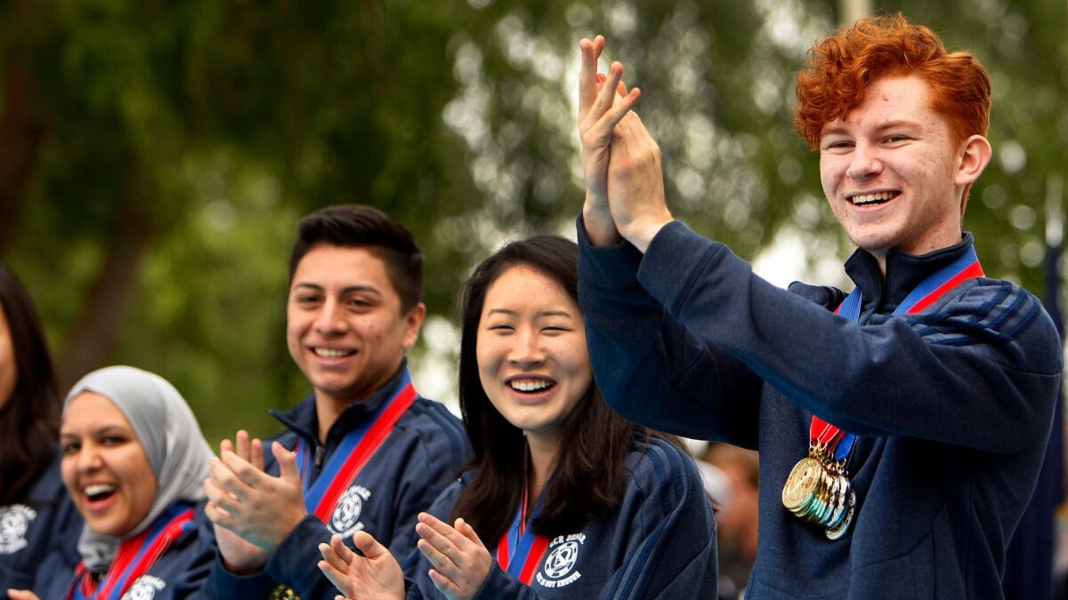 The team from El Camino Real Charter High School celebrates on its way to winning the 2014 national Academic Decathlon. The school has 30 days to address issues over its leadership and spending.