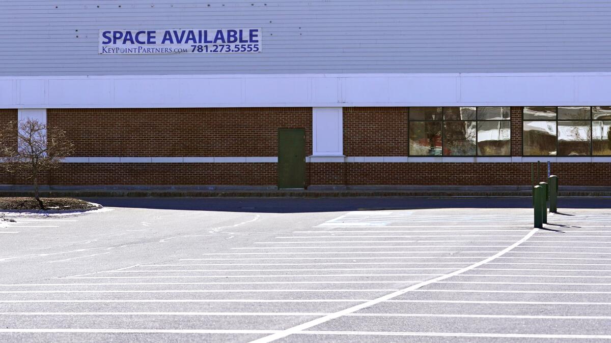 A "Space Available" real estate sign is posted on the facade of a closed supermarket, Tuesday, March 2, 2021, in Manchester, N.H. After a year of ghostly airports, empty sports stadiums and constant Zoom meetings, growing evidence suggests that the economy is strengthening. Hiring picked up in February 2021. Business restrictions have eased as the pace of viral infections has ebbed. Yet the economy remains far from normal. (AP Photo/Charles Krupa)