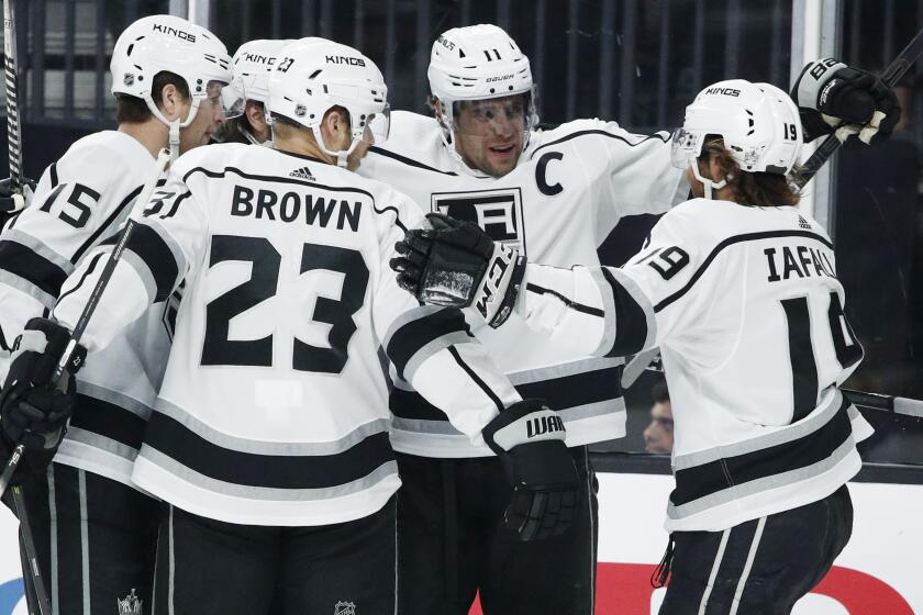 Los Angeles Kings center Anze Kopitar, second from right, celebrates after scoring against the Vegas Golden Knights.