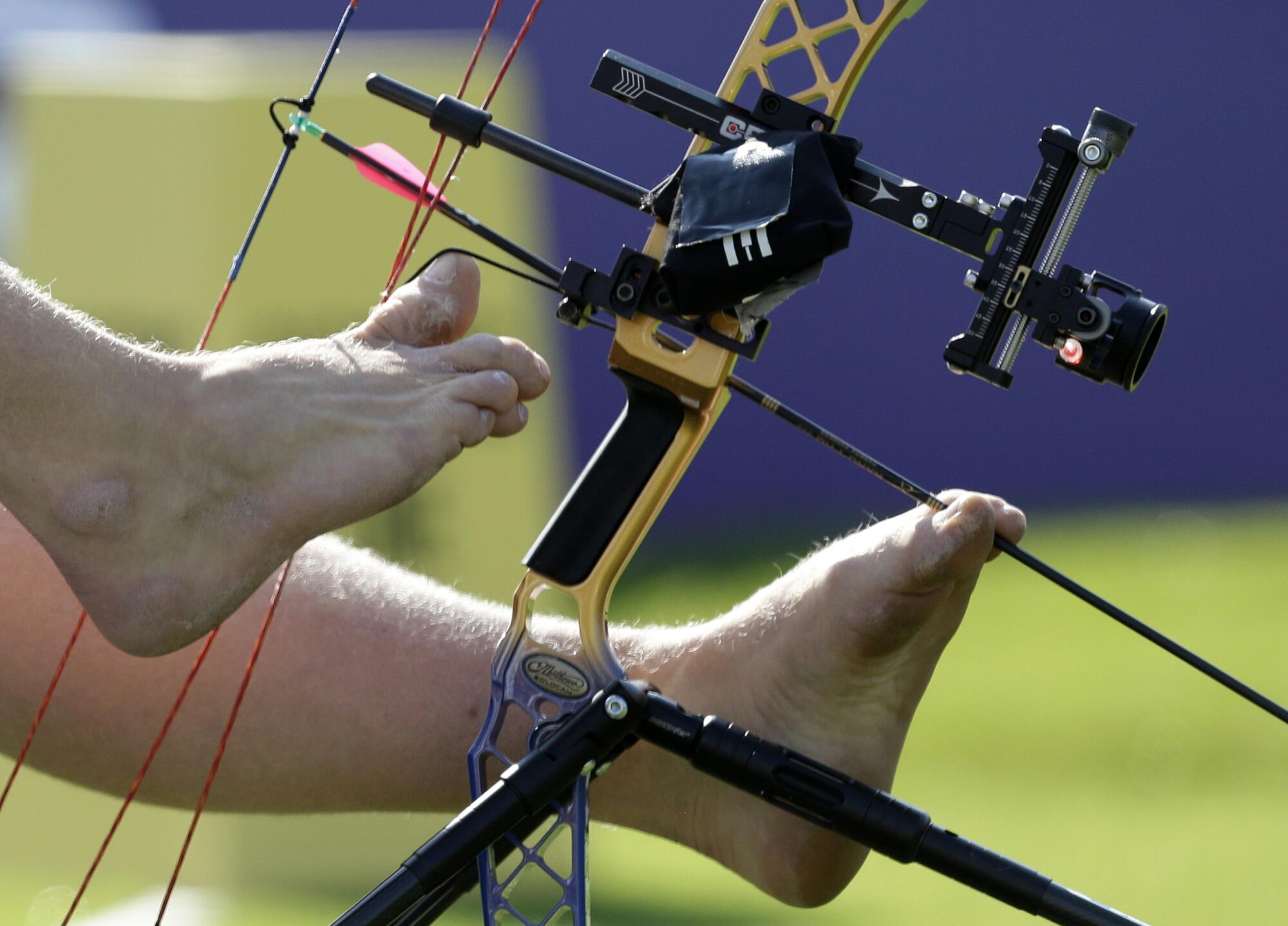 Early on, Matt Stutzman used both feet to load and shoot an arrow. Now he uses one.