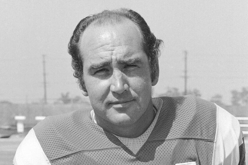 FILE - Los Angeles Rams football player John Hadl is shown in August 1973. Longtime NFL quarterback John Hadl, who starred for his hometown Kansas Jayhawks before embarking on a professional career that included six Pro Bowl appearances and an All-Pro nod, died Wednesday, Nov. 30, 2022. He was 82. The university, where Hadl returned after his playing days as a coach and fundraiser, announced his death at the wishes of his family in a statement. No cause was given. (AP Photo)