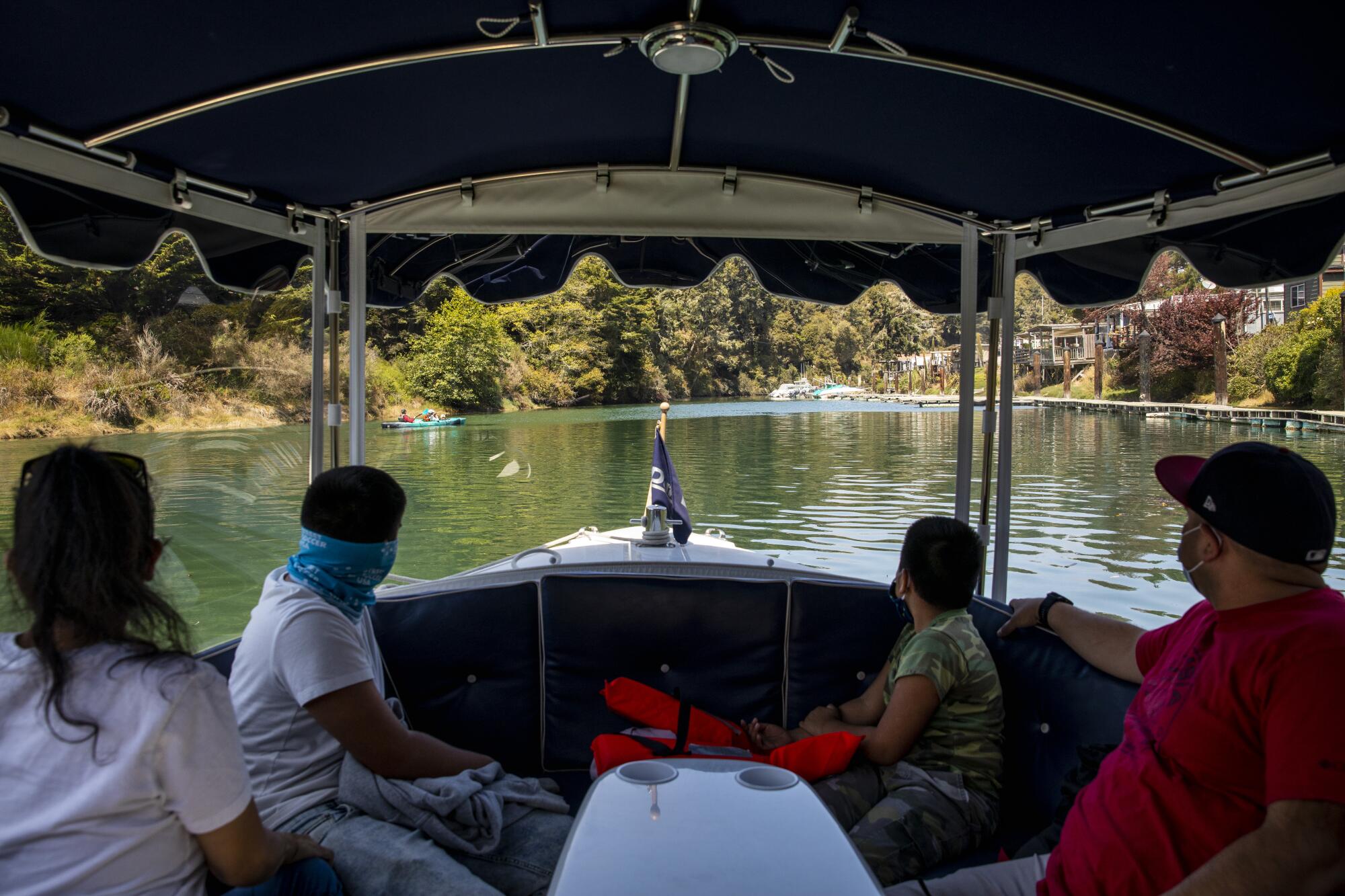 Visitors view the scenery on a boat tour
